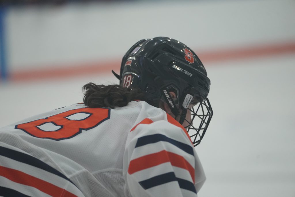 The picture is of Tatum White from Syracuse. She is getting set to take a faceoff for the Orange. 