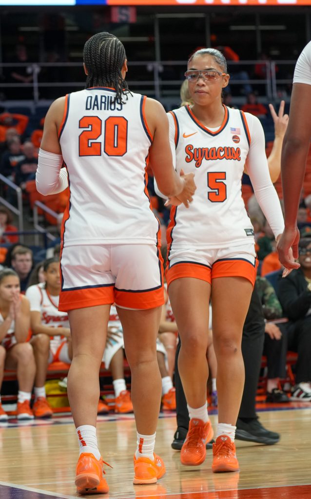 dominique darius and laila phelia dapping each other up