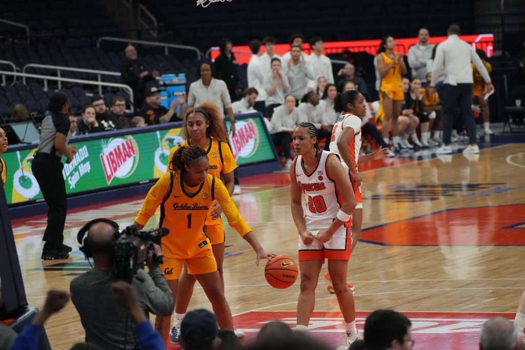 Dominique Darius of Syracuse flexes and celebrates after hitting a shot over a Cal defender at the JMA Wireless Dome. 