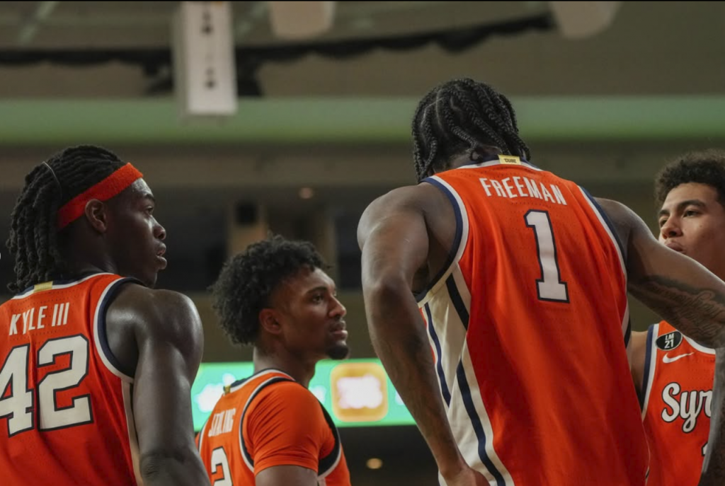 William Kyle and the Orange huddle up after committing a foul